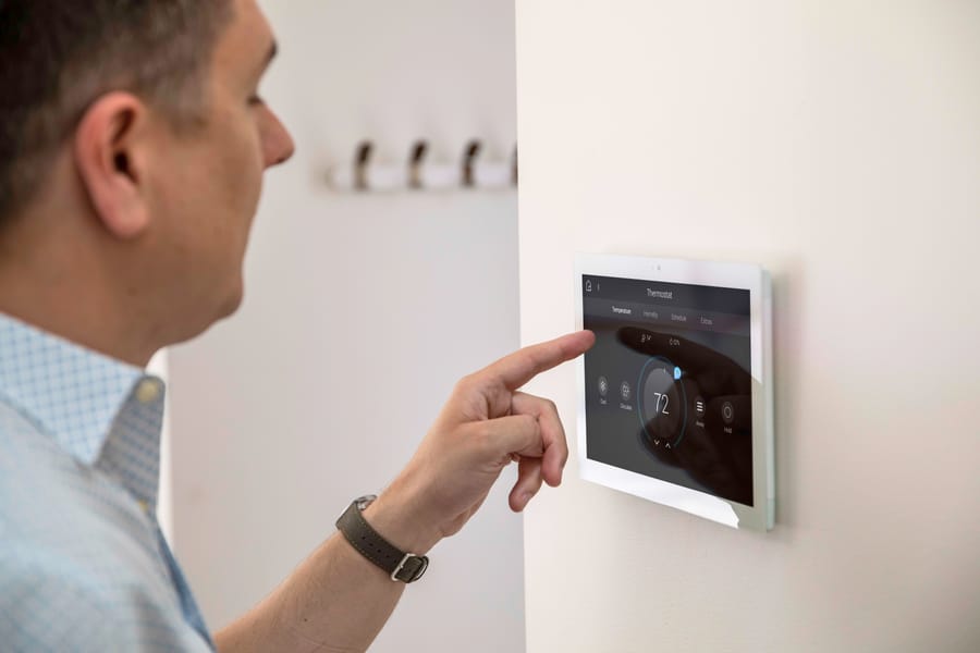 Staff using a wall touchscreen